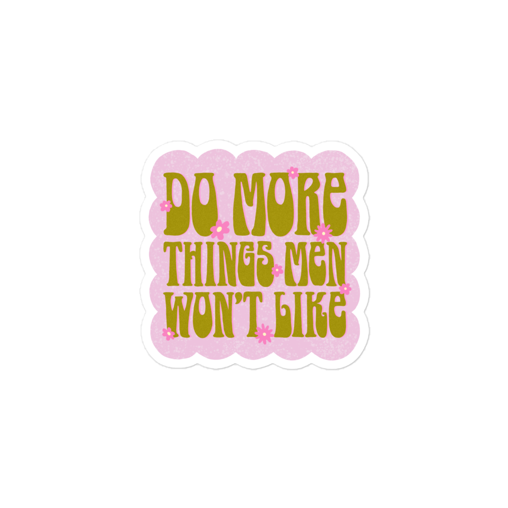 3x3 Feminist sticker with the message 'Do More Things Men Won’t Like' in a lime army green 70s retro font, accented with pink flower details and set against a bubble pink background.