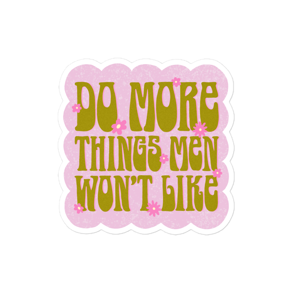 Empowering Feminist sticker featuring the phrase 'Do More Things Men Won’t Like' in a 70s retro lime army green font, with pink flower accents on a bubble pink background
