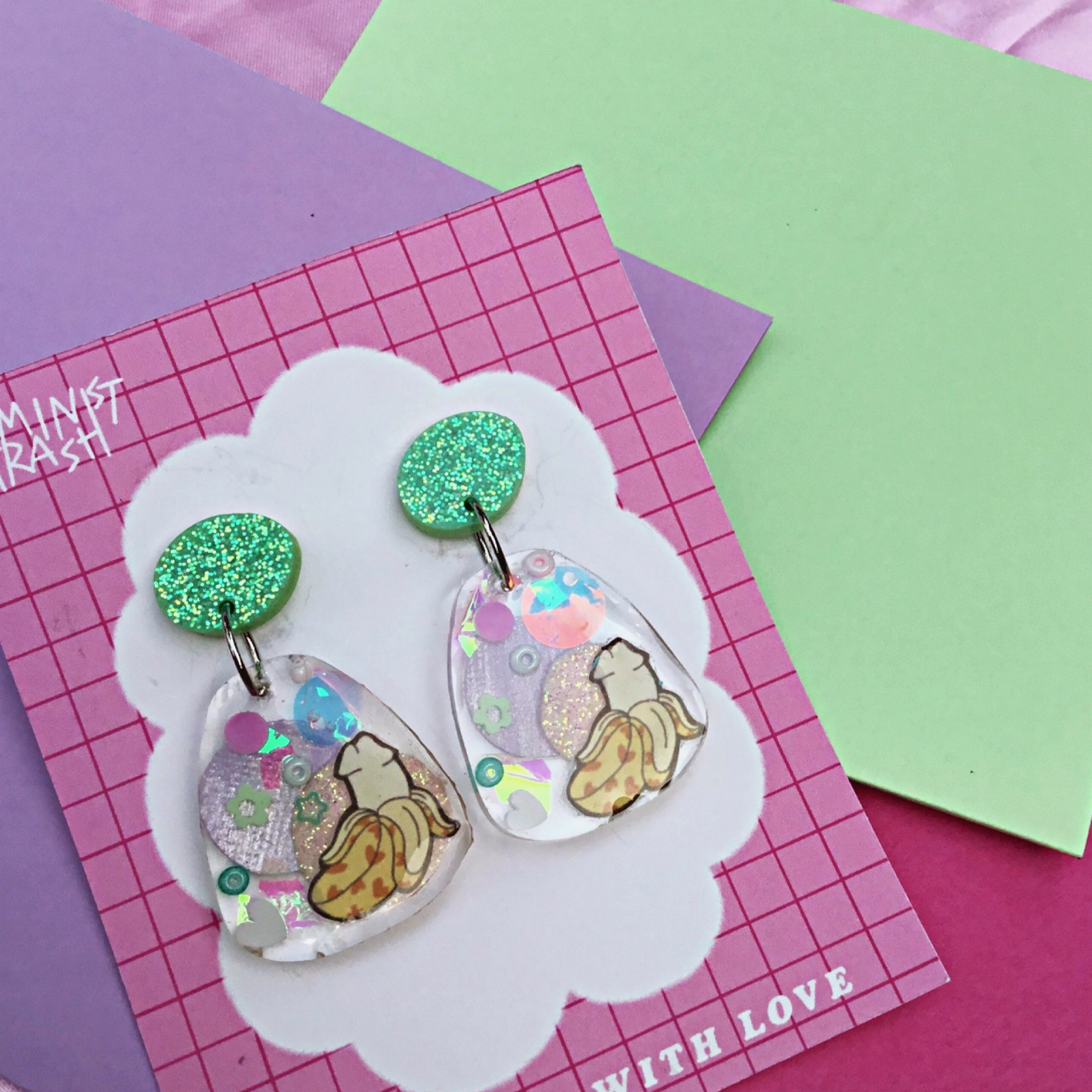 Adorn your ears with these super cute Banana Penis dangle feminist earrings. Made out of resin and glitter. Shop Feminist jewellery for the empowered woman