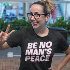 Black feminist tee that says be no man's peace in bold white writing with pink accents- Shop feminist apparel