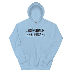 blue feminist hoodie that says abortion is healthcare in black hand lettering