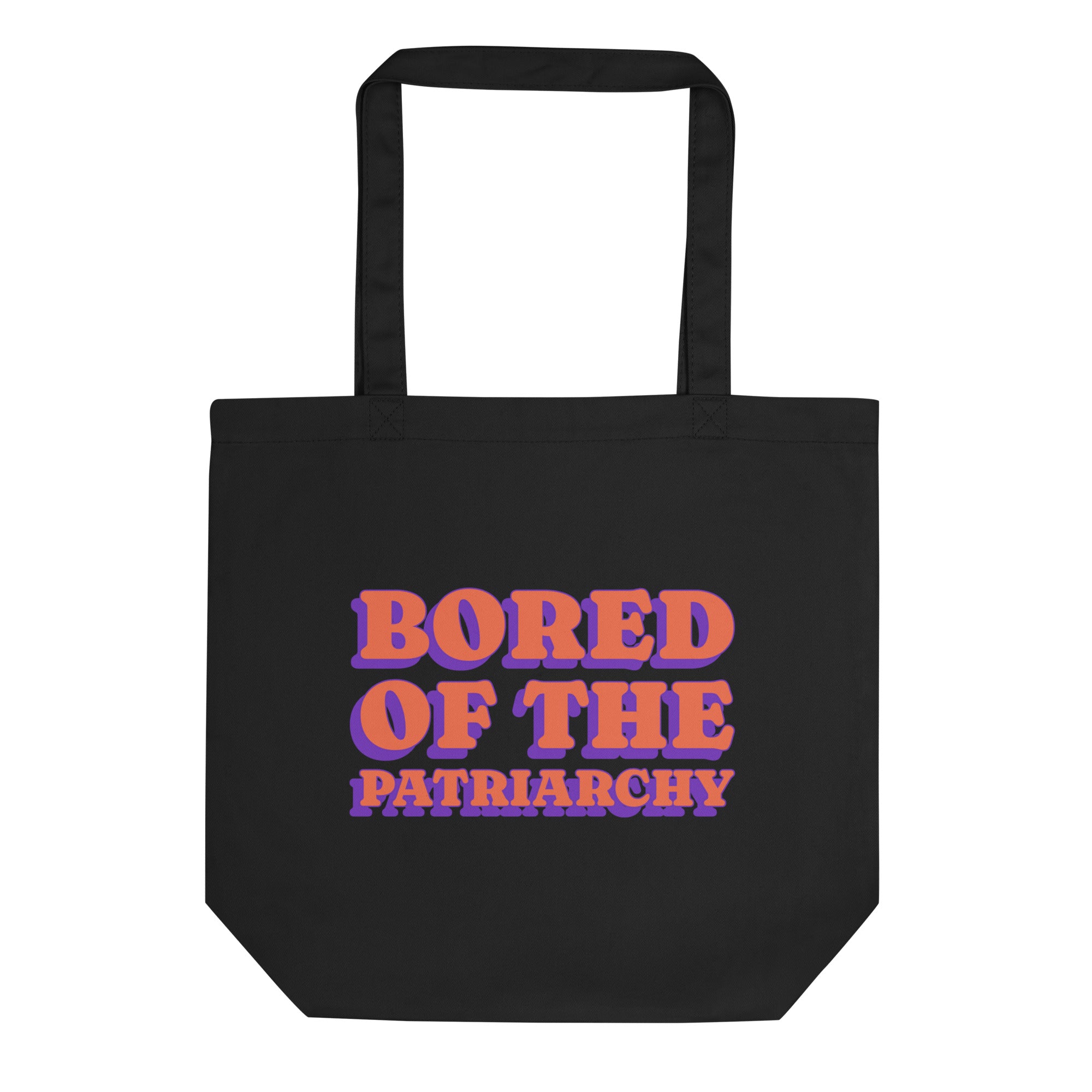 Black feminist tote bag that says bored of the patriarchy in orange and purple retro writing- shop feminist trash for feminist apparel, political t-shirts and outfits or pride