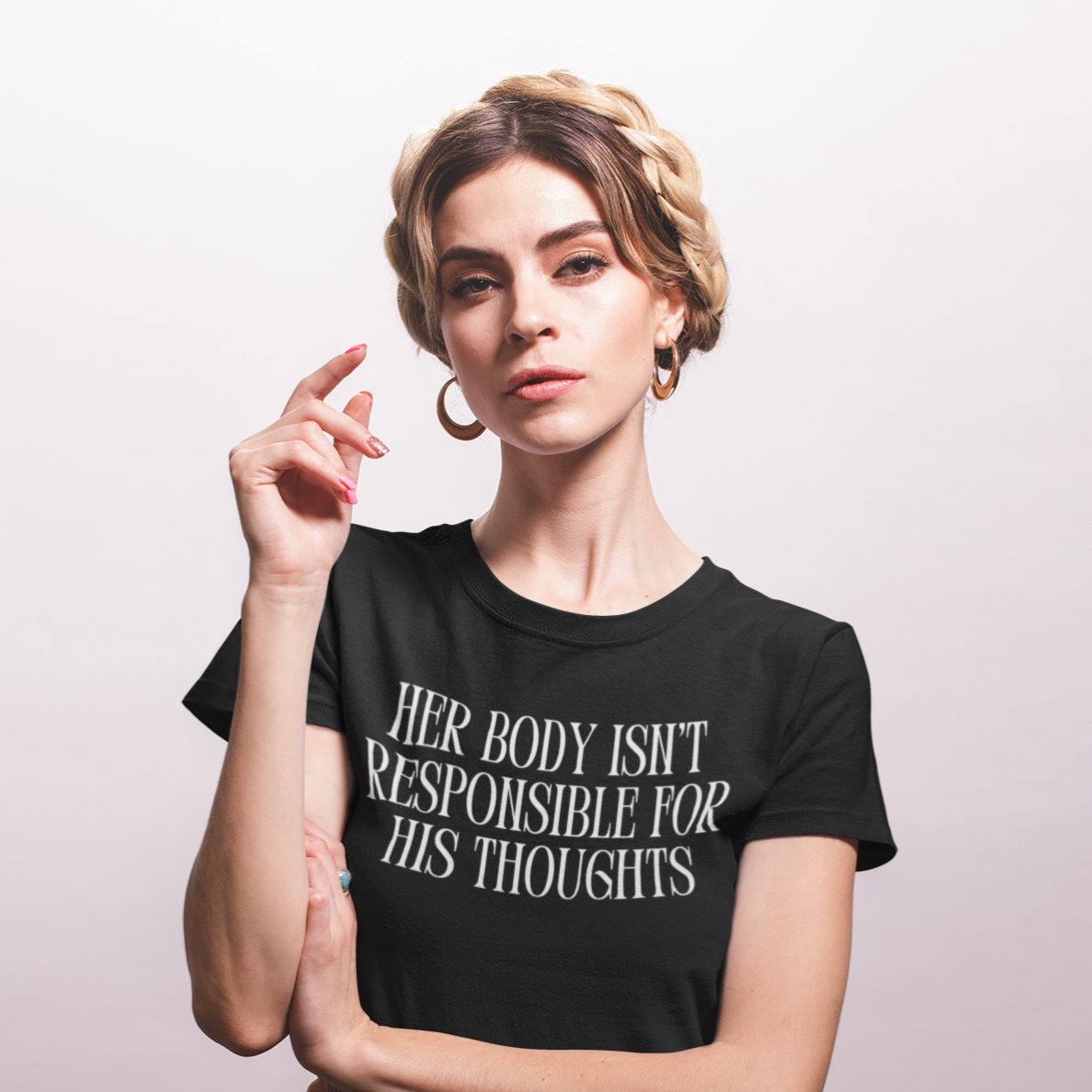 Black feminist shirt that says her body isn't responsible for his thoughts in white writing- Shop Feminist Apparel