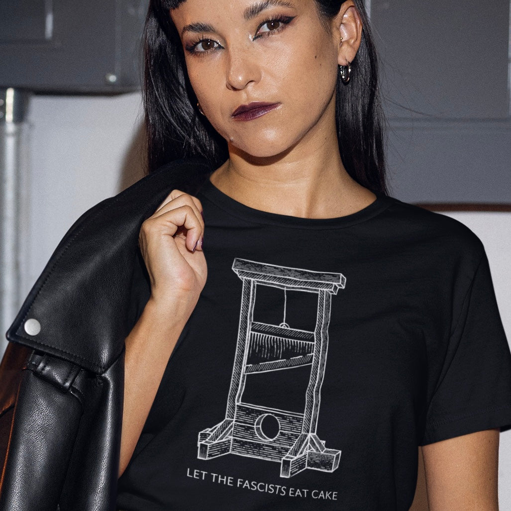 black political tshirt that says Let The Fascists Eat Cake in white writing featuring an illustration of a guillotine- shop feminist trash for political clothing, feminist shirts, acab tshirts and pride merch