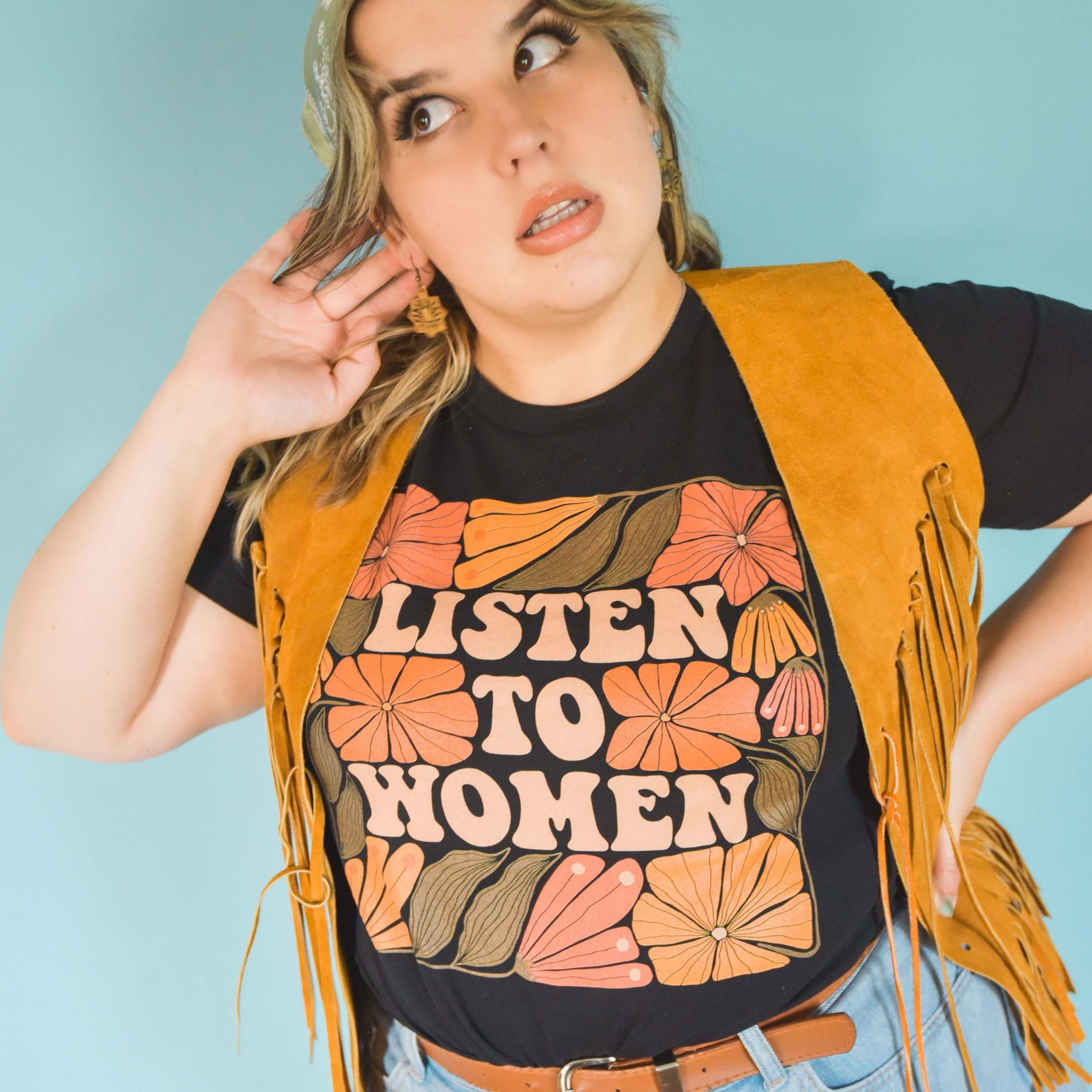 Feminist shirt that says listen to women in retro writing. This hand-lettered intersectional feminist shirt is the perfect statement piece. Shop social justice feminist tees today!