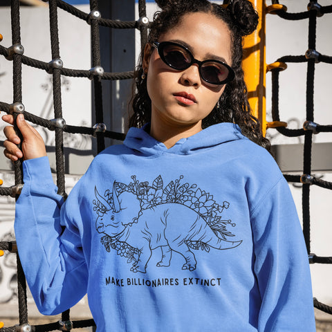 blue hoodie that says make billionaire extinct in black writing featuring an illustration of a triceratops surrounded by flowers- shop feminist trash for political clothes, feminist hoodies and pride merch