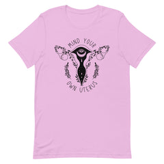 Lilac feminist shirt that says mind your own uterus. featuring a black witchy uterus illustration- shop graphic tees