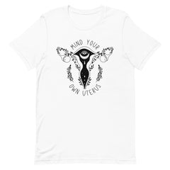 white feminist tshirt that says mind your own uterus featuring a black witchy uterus illustration- shop women's empowerment tees