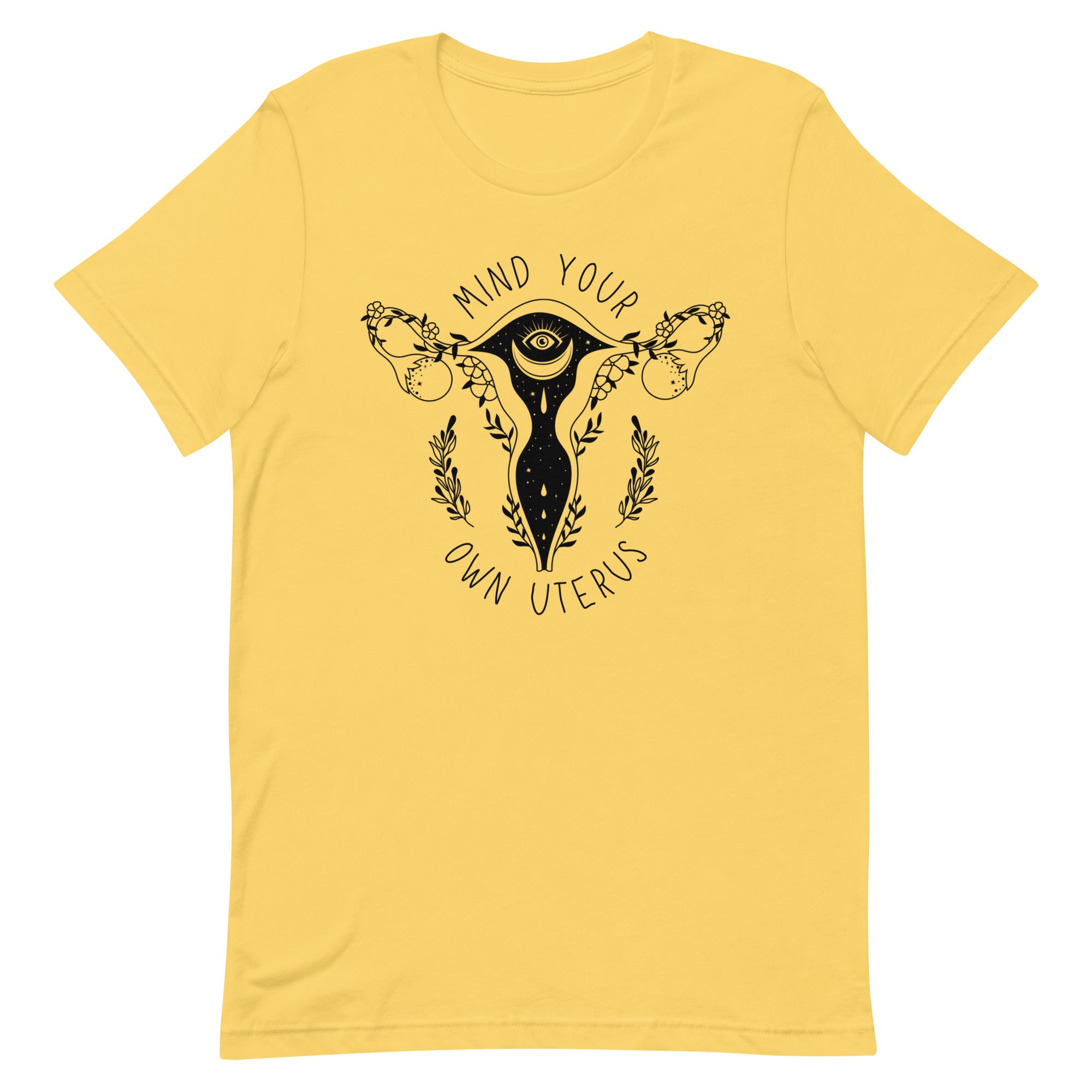 yellow feminist tshirt that says mind your own uterus featuring a black witchy illustration of a uterus- shop feminist shirts
