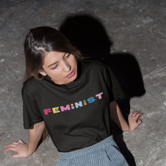 Black feminist tshirt that says feminist in rainbow bold writing- Shop social justice tees