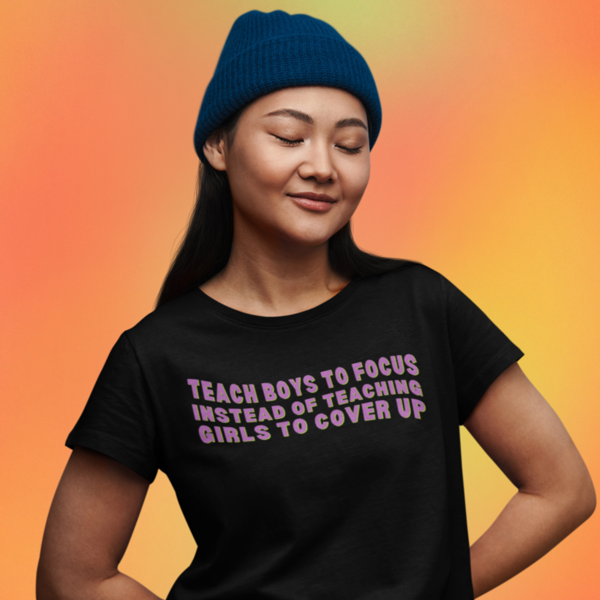 Black feminist shirt that says Teach Boys To Focus Instead Of Teaching Girls To Cover Up In Purple Wavy Writing- Shop Women’s Rights T-shirts and Women's March Merchandise