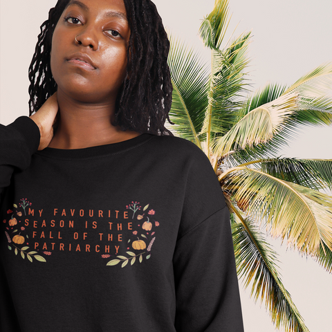 Black feminist sweatshirt with the empowering message 'My Favorite Season is the Fall of the Patriarchy,' advocating for empowerment and gender equality- shop Feminist Trash for feminist sweatshirts and political clothing