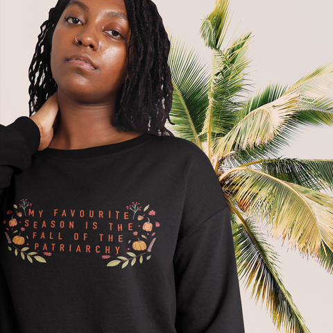 Black feminist sweatshirt with the empowering message 'My Favorite Season is the Fall of the Patriarchy,' advocating for empowerment and gender equality