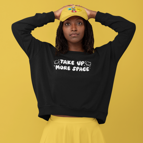 Black feminist sweatshirt with the empowering message 'Take Up More Space,' advocating for empowerment and gender equality. Shop Feminist Trash for a range of dump him shirts, feminist apparel, pride tees and political clothing
