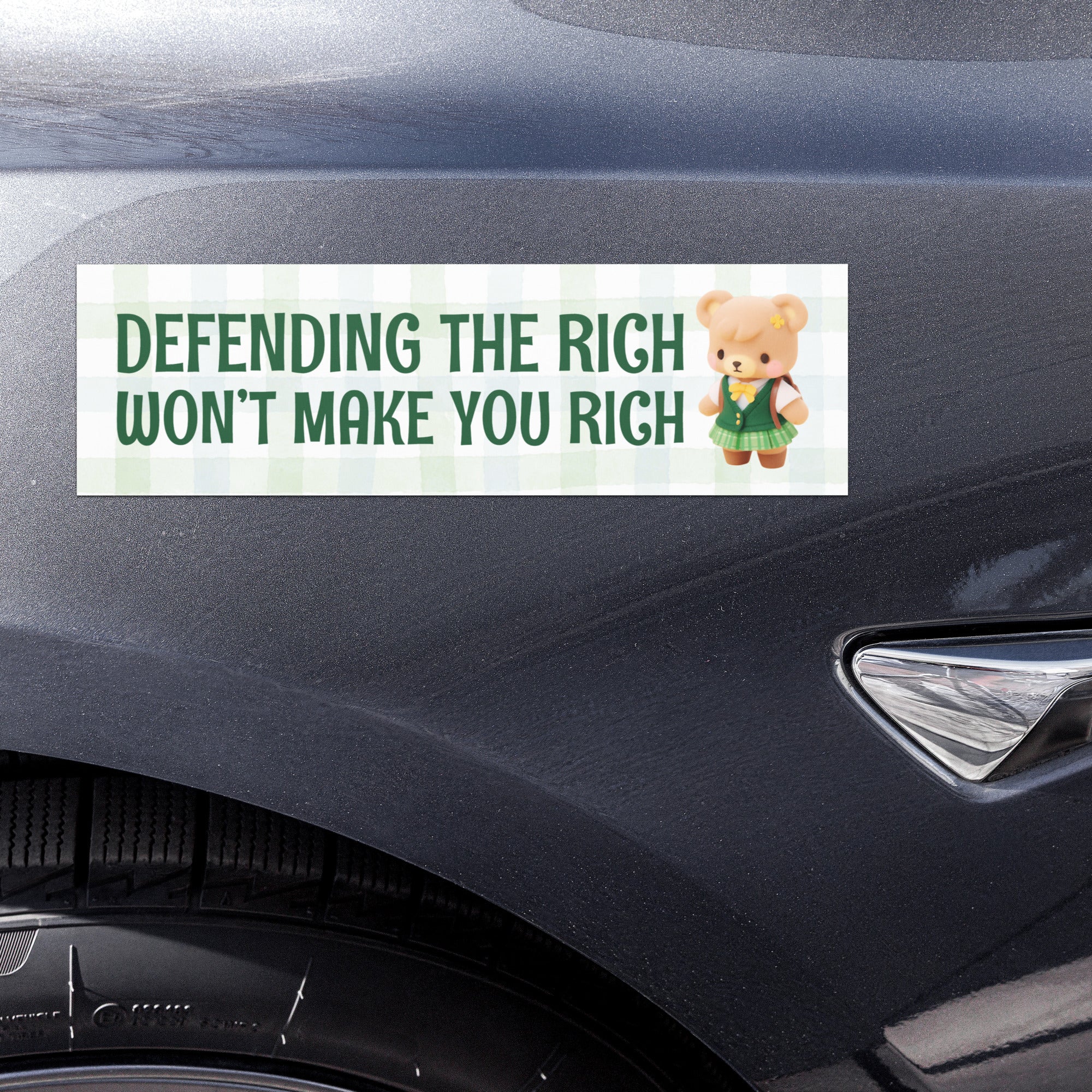 magnetic bumper sticker with text 'DEFENDING THE RICH WON'T MAKE YOU RICH' and a cartoon bear- shop feminist trash for political clothing, magnetic bumper stickers and pride merch