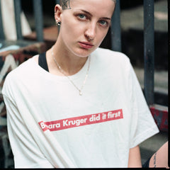 White Feminist T-Shirt  that says "Barbara Kruger Did It First" in a Supreme Graphic - Shop Empowering Feminist T Shirts, acab t-shirts, political clothing, dump him shirts and pride outfits.