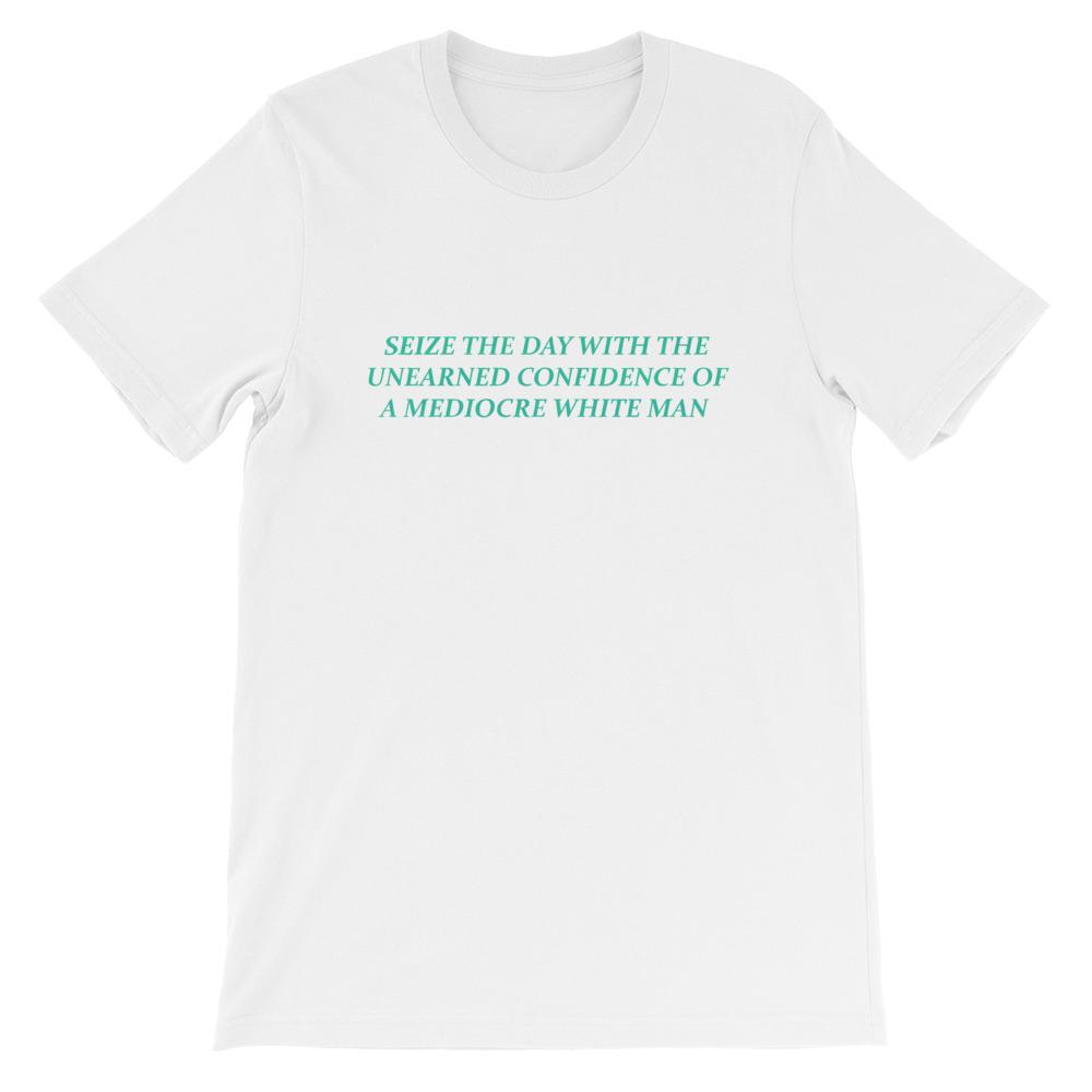 White Feminist T-shirt that says Seize The Day With The Unearned Confidence Of A Mediocre White Man in light teal writing- Shop Feminist Trash Store for funny t shirts for women, political clothing, pride shirts and dump him shirts