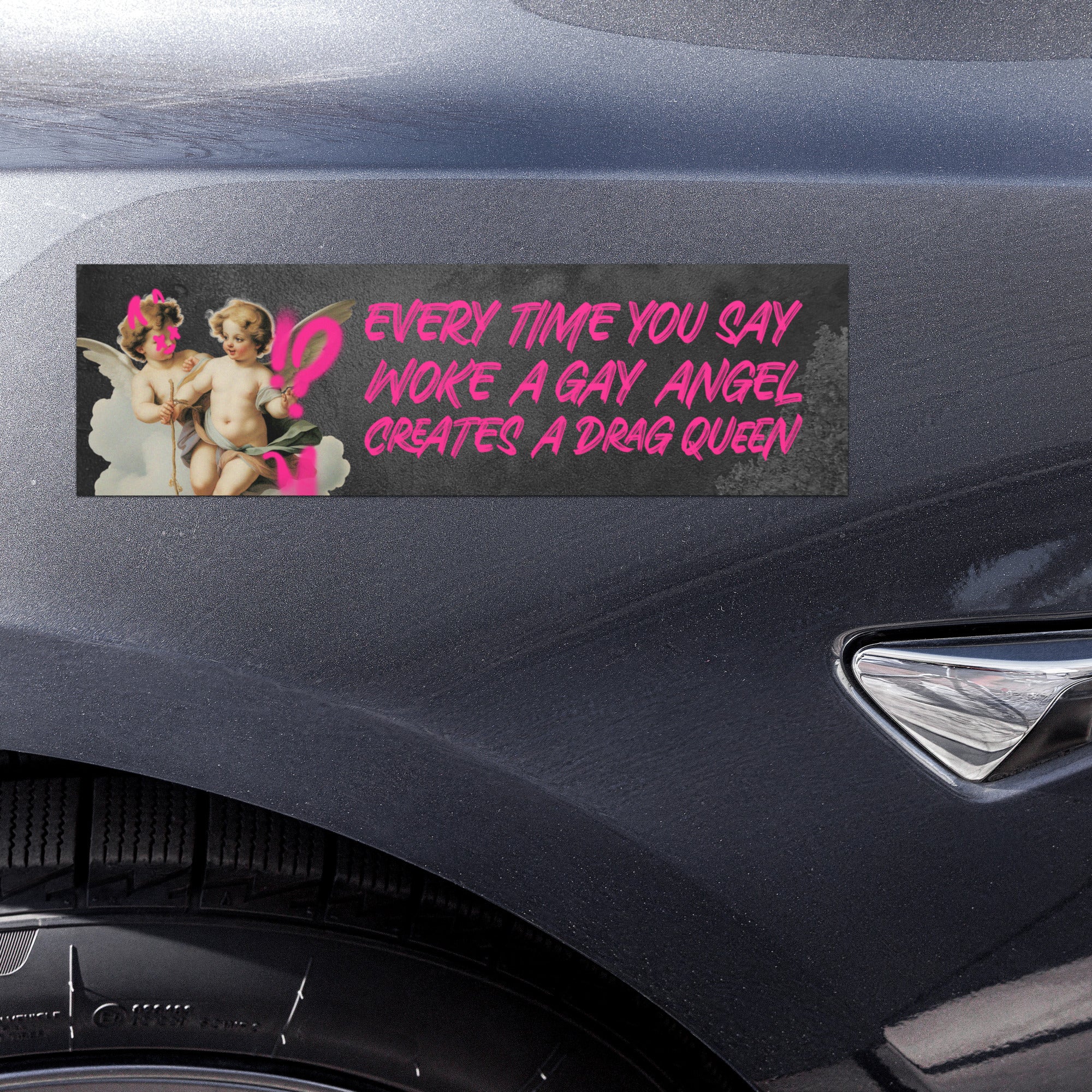 car magnet that says every time you say woke a gay angel creates a drag queen in pink grafitti wriing- shop feminist trash store for feminist apparel, funny car magnets and pride merch.