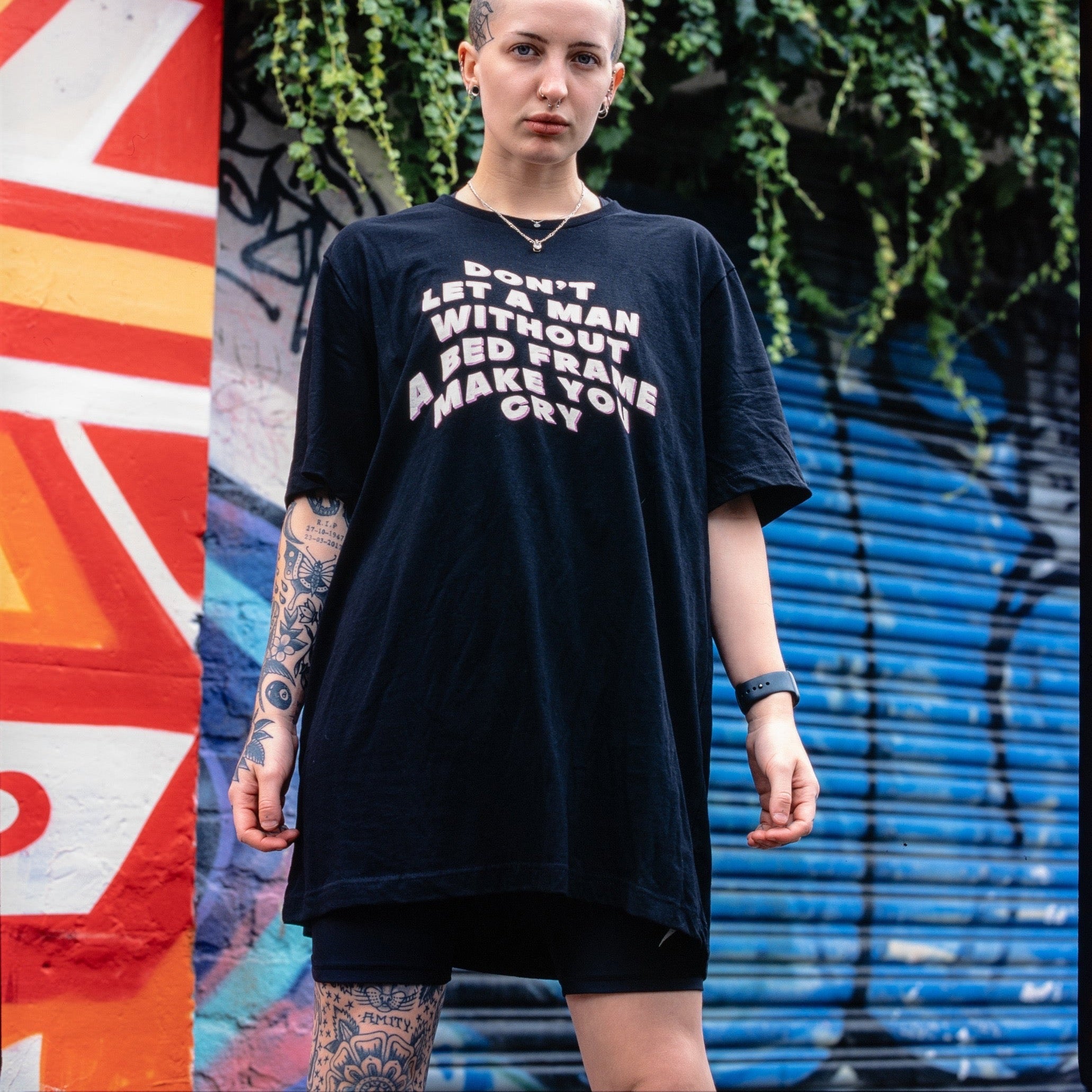 Empowering black feminist shirt featuring the message "Don't Let a Man Without a Bed Frame Make You Cry."