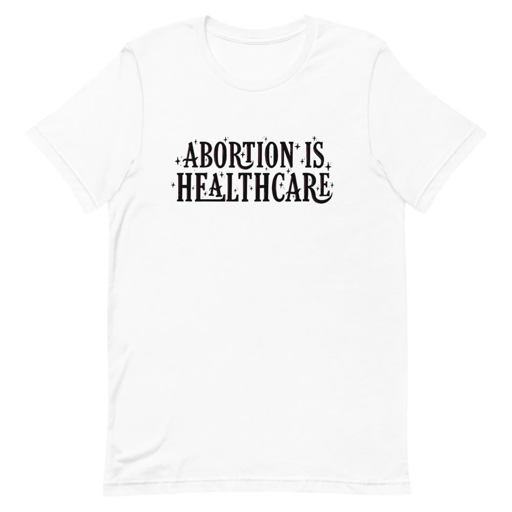 Feminist t-shirt in white advocating 'Abortion is Healthcare' in black writing- shop feminist shirts