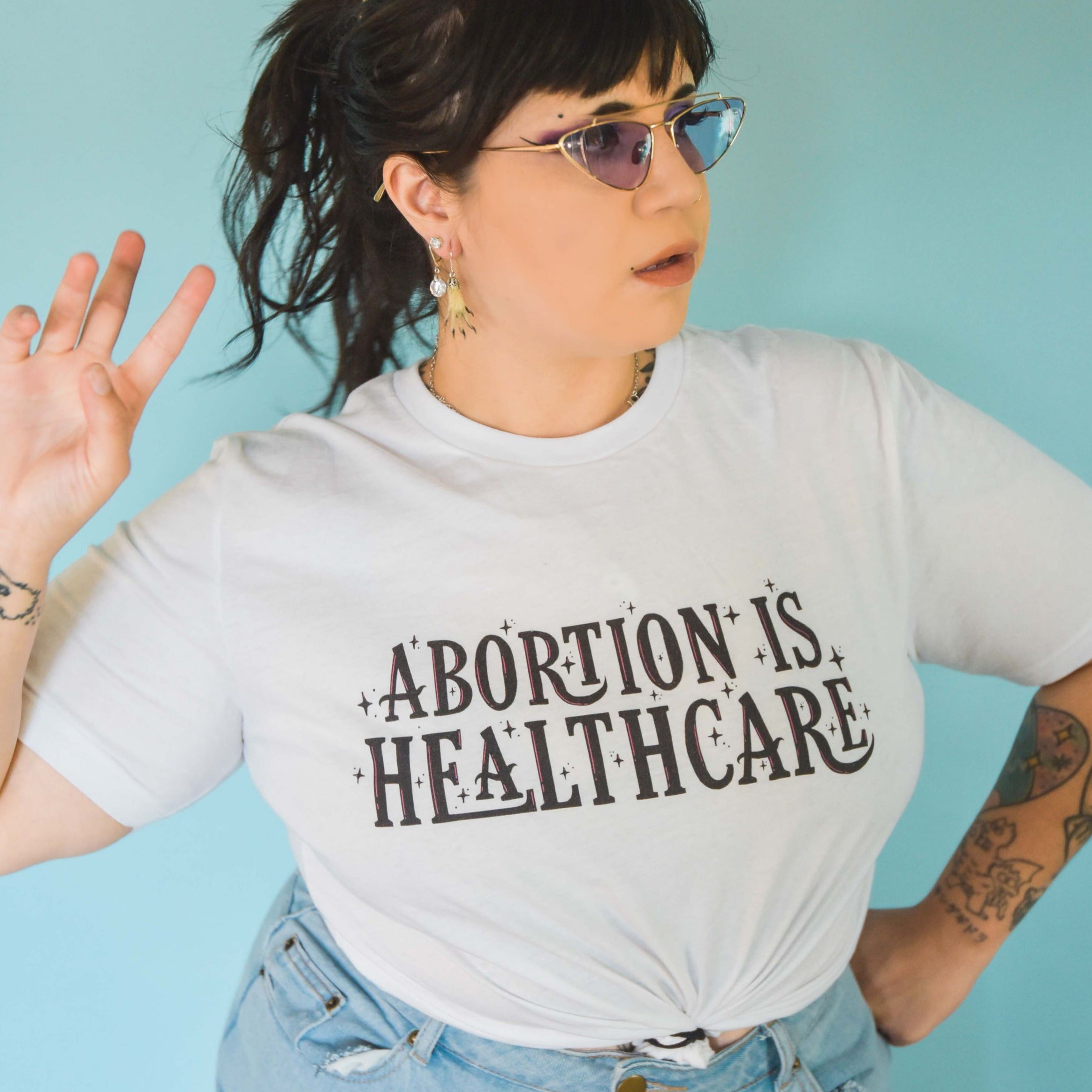 White feminist t shirt with 'Abortion is Healthcare' slogan- Shop feminist tshirts