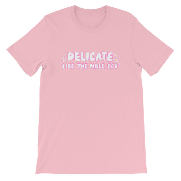pink feminist t-shirt that says 'Delicate Like the Male Ego in white bubble writing with pink accents and small daisy illustrations- shop feminist apparel, dump him shirts and political clothes.