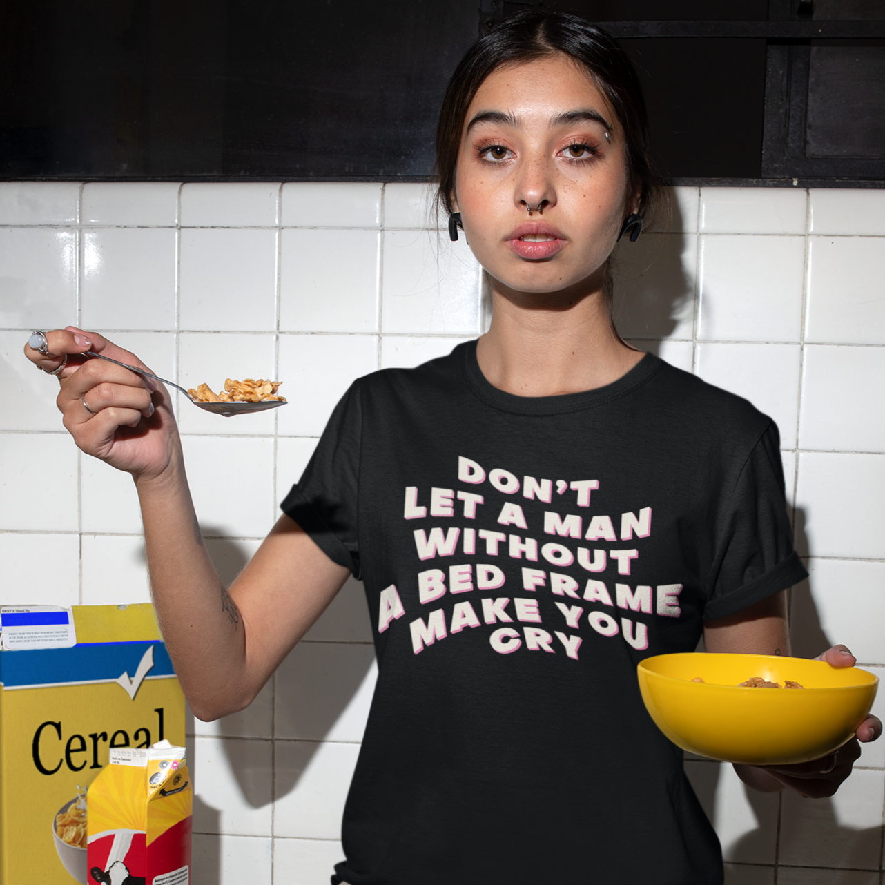 Black feminist t-shirt boldly stating "Don't Let a Man Without a Bed Frame Make You Cry"