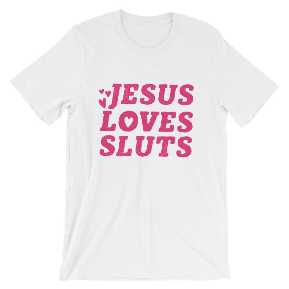 White feminist t-shirt that says 'Jesus Loves Sluts' in red hand lettered writing- shop Feminist Trash for feminist apparel, political clothing, acab t-shirts, pride outfits and dump him shirts.