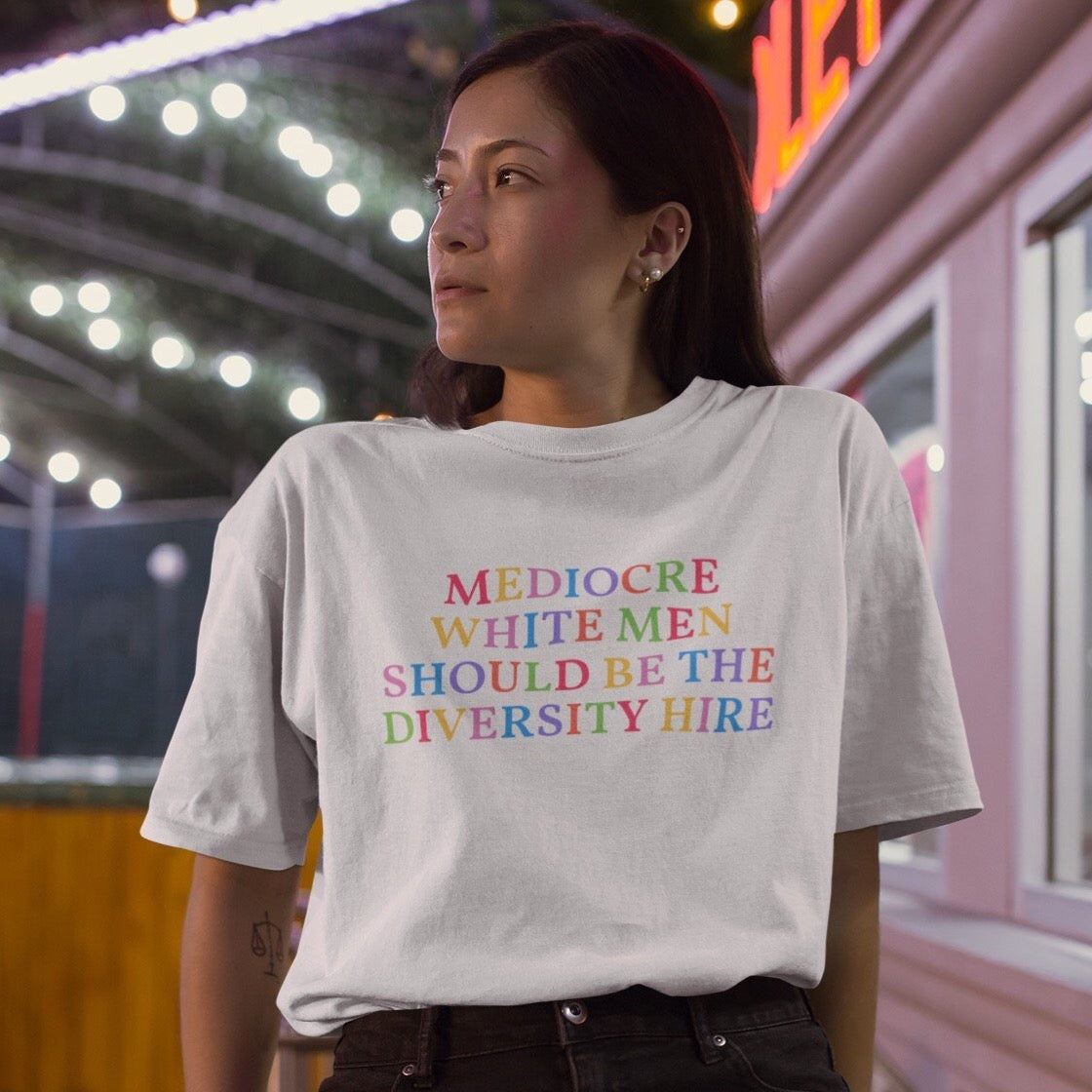 White feminist t-shirt that says Mediocre White Men Should Be The Diversity Hire' in rainbow writing- define feminism with our political clothes, feminist tees and dump him shirts