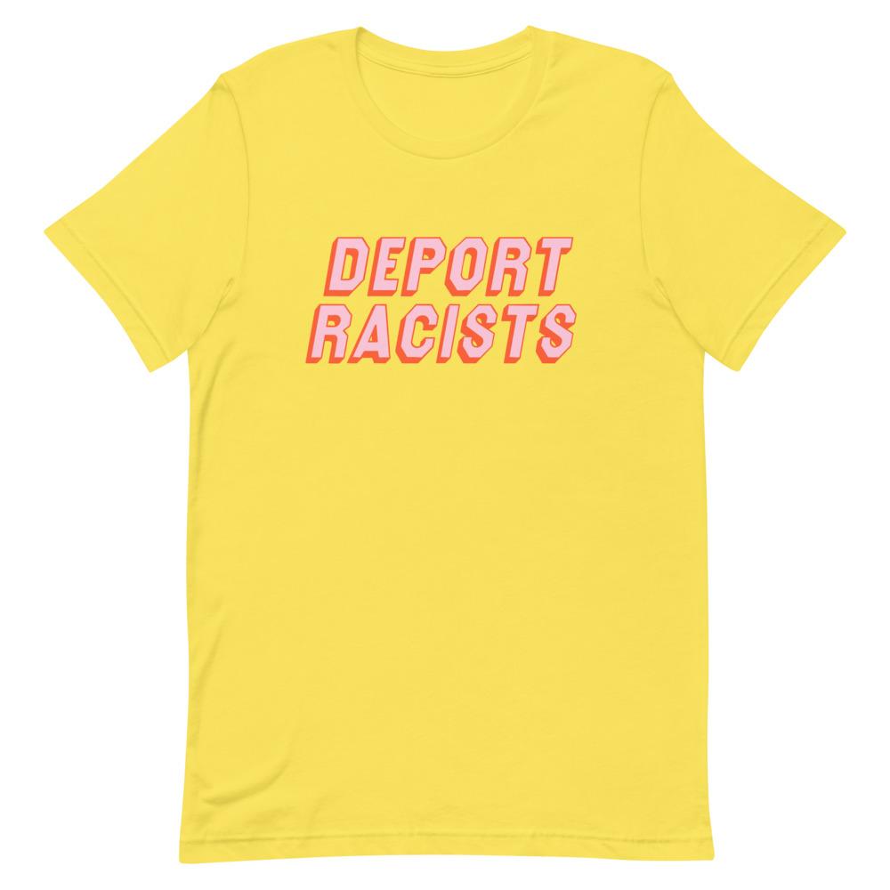 Yellow feminist t shirt conveying: "Deport Racists" in peach writing- shop graphic tees