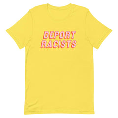 Yellow feminist t shirt conveying: "Deport Racists" in peach writing- shop graphic tees
