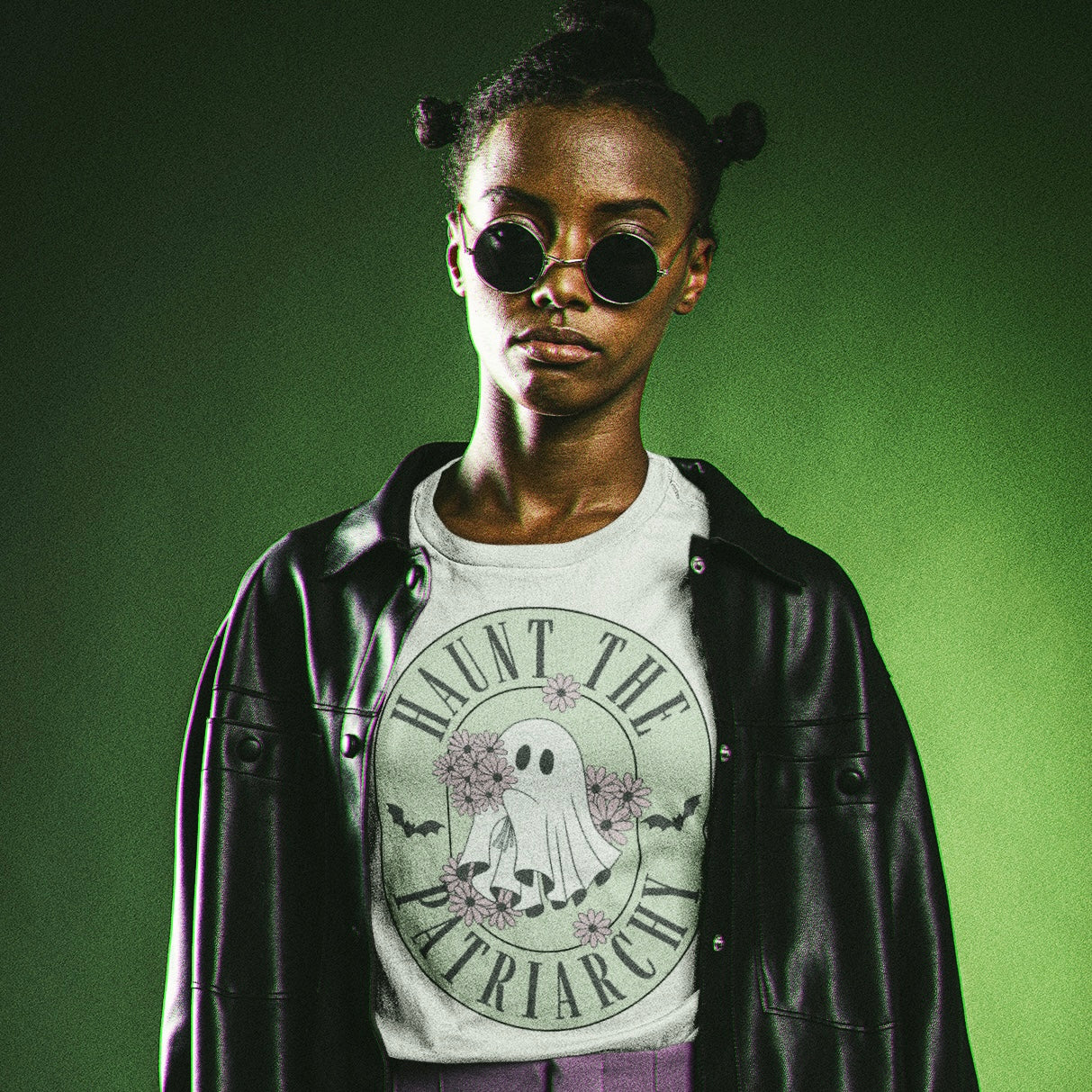 halloween inspired feminist tshirt that says haunt the patriarchy- featuring a cute ghost holding lilac daisies illustration- shop feminist trash for witchy outfits and feminist shirts