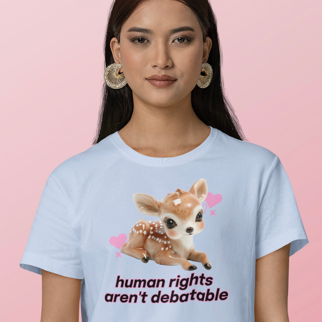 baby blue political tshirt that says human rights aren't debatable in black writing featuring a 3d image of a baby deer. Shop feminist trash for political clothing and feminist t-shirts