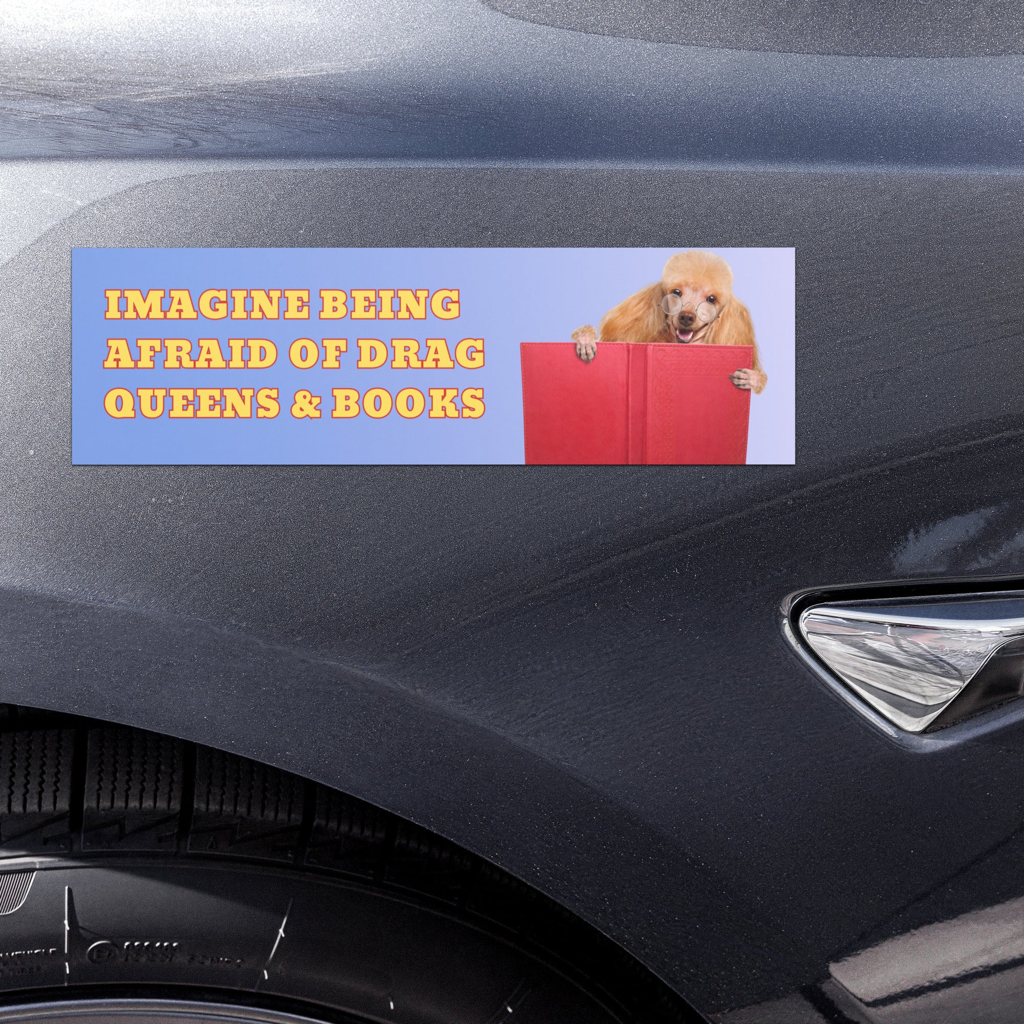 blue gradient political bumper sticker that says imagine being afraid of drag queens & books in yellow bold writing featuring a picture of a golden poodle reading a red book- shop feminist trash store for magnetic bumper stickers, feminist t-shirts and pride shirts