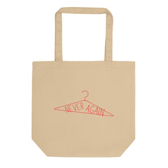 beige pro choice feminist tote bag that says never again inside an illustrated coat hanger- shop feminist trash for pro choice t-shirts and political clothes
