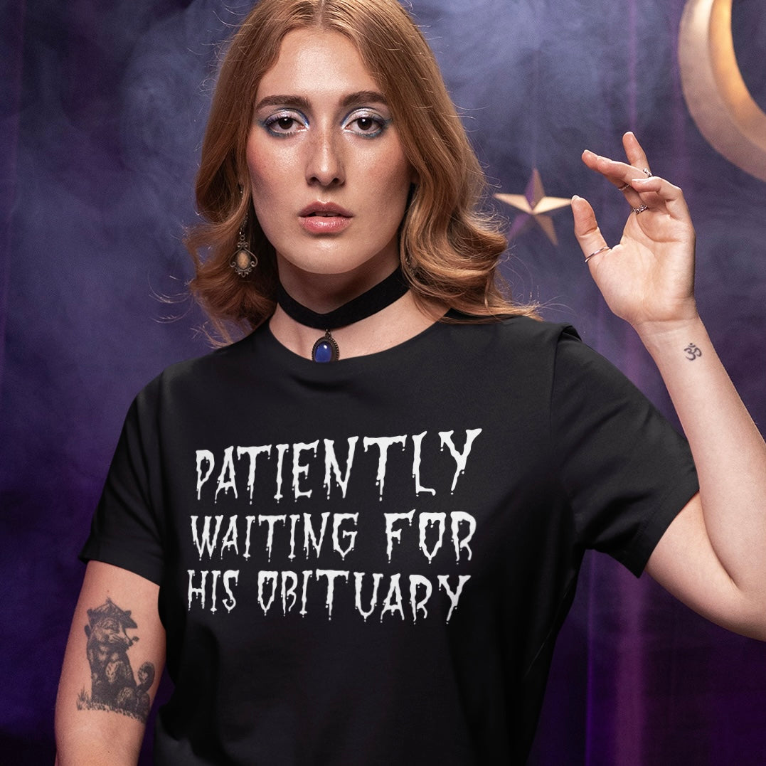black anti trump t-shirt that says patiently waiting for his obituary in white spooky writing- shop feminist trash for political t-shirts
