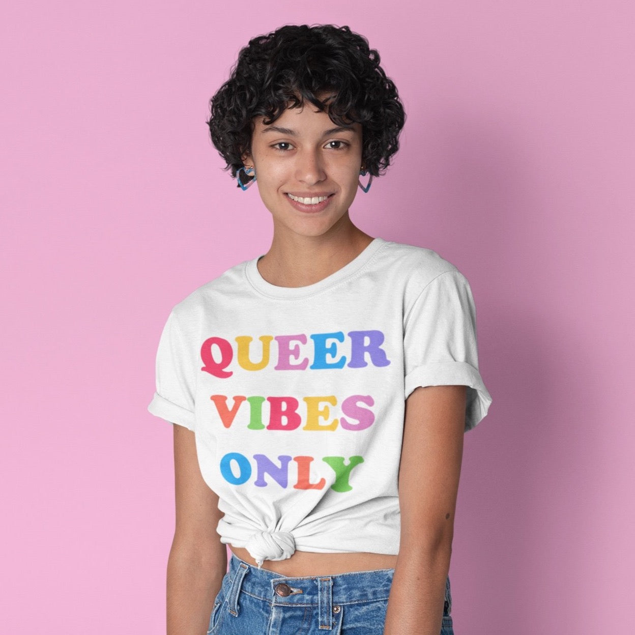 white Pride t-shirt in black proclaiming "Queer Vibes Only" in rainbow writing- define pride with our pride tees, political clothing, pride clothing, pride merch and dump him shirts