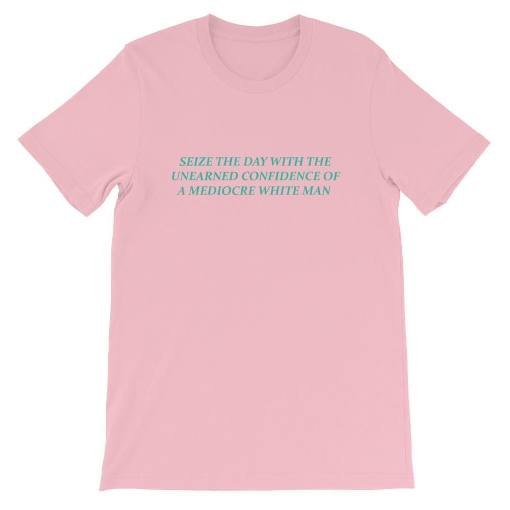 Pink Feminist T-shirt that says Seize The Day With The Unearned Confidence Of A Mediocre White Man in light teal writing- Shop Feminist Trash Store for funny t shirts for women, political clothing, acab t-shirts and pride shirts