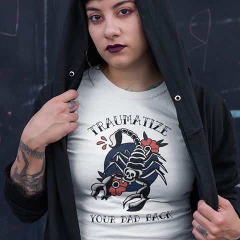 white feminist t-shirt that says traumatize your dad back in black old school tattoo writing featuring a tattoo illustration of a scorpion and flowers. Shop feminist trash for feminist t-shirts and dump him shirts