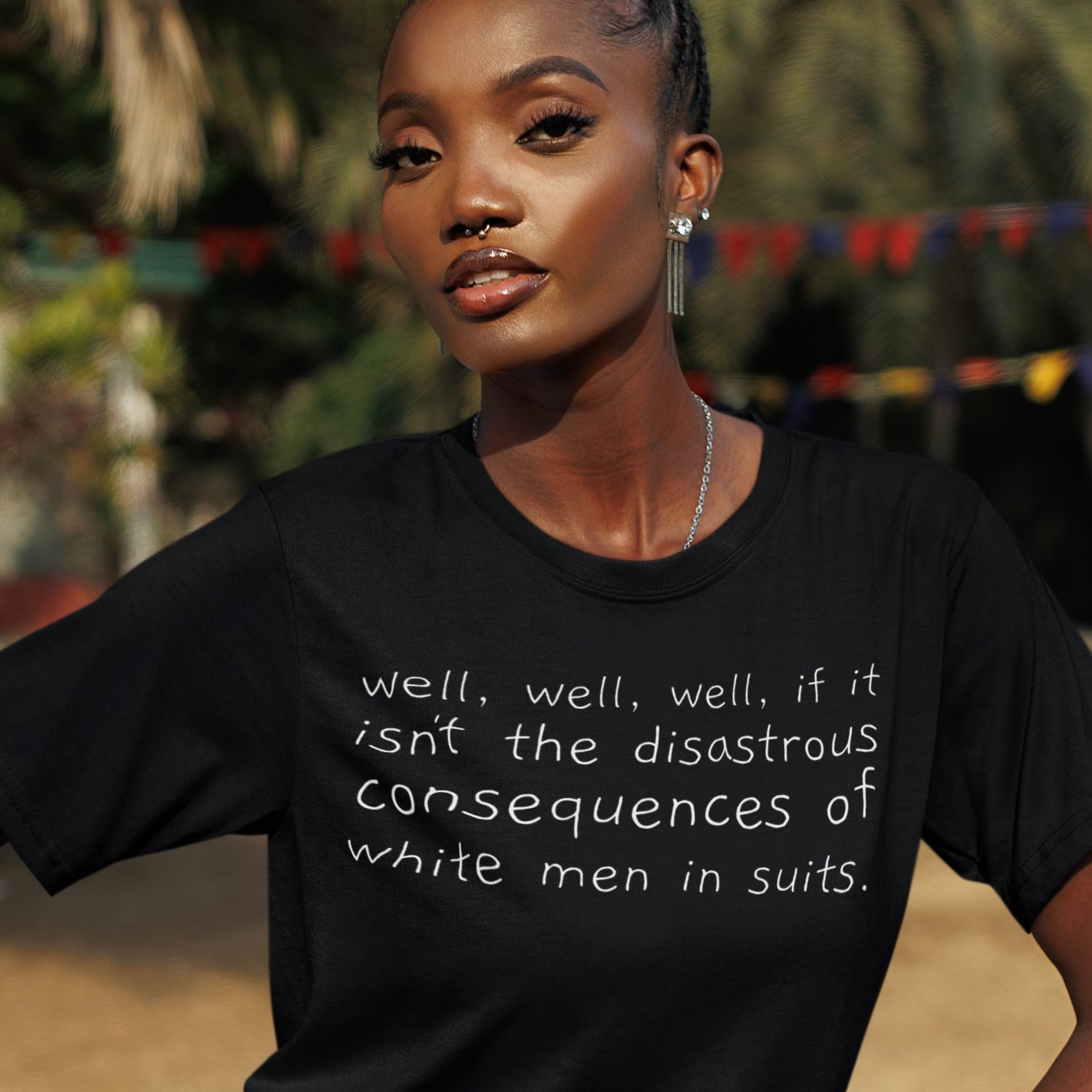 black political t-shirt that says well, well, well, if it isn't the disastrous consequences of white men in suits in white hand lettered writing- shop feminist trash store for political shirts, pride merch and feminist tees.