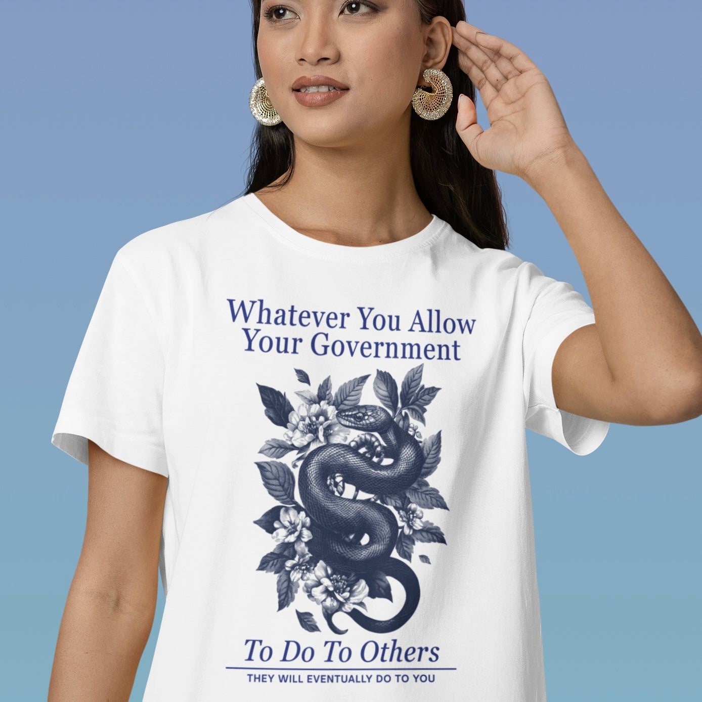 white political tee that says whatever you allow your government to do to others they will eventually do to you in navy writing featuring a floral snake design- shop feminist trash for anti fascist t-shirts and political clothing