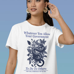 white political tee that says whatever you allow your government to do to others they will eventually do to you in navy writing featuring a floral snake design- shop feminist trash for anti fascist t-shirts and political clothing