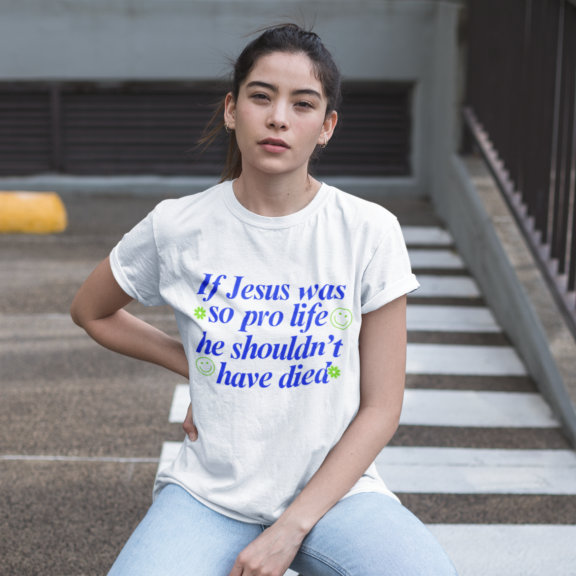 White feminist t-shirt with the message 'If Jesus Was So Pro Life She Shouldn’t Have Died,' advocating for gender equality and justice, suitable for women’s rights