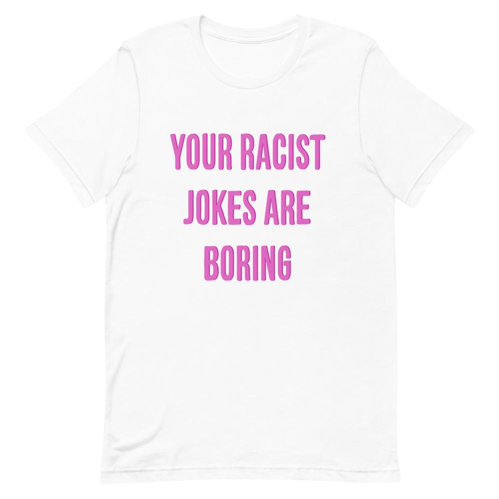 White Feminist T-Shirt that says "Your Racist Jokes Are Boring" in pink writing- Express grl pwr with our feminist clothing, political clothes, dump him shirts, pride shirts and witchy outfits