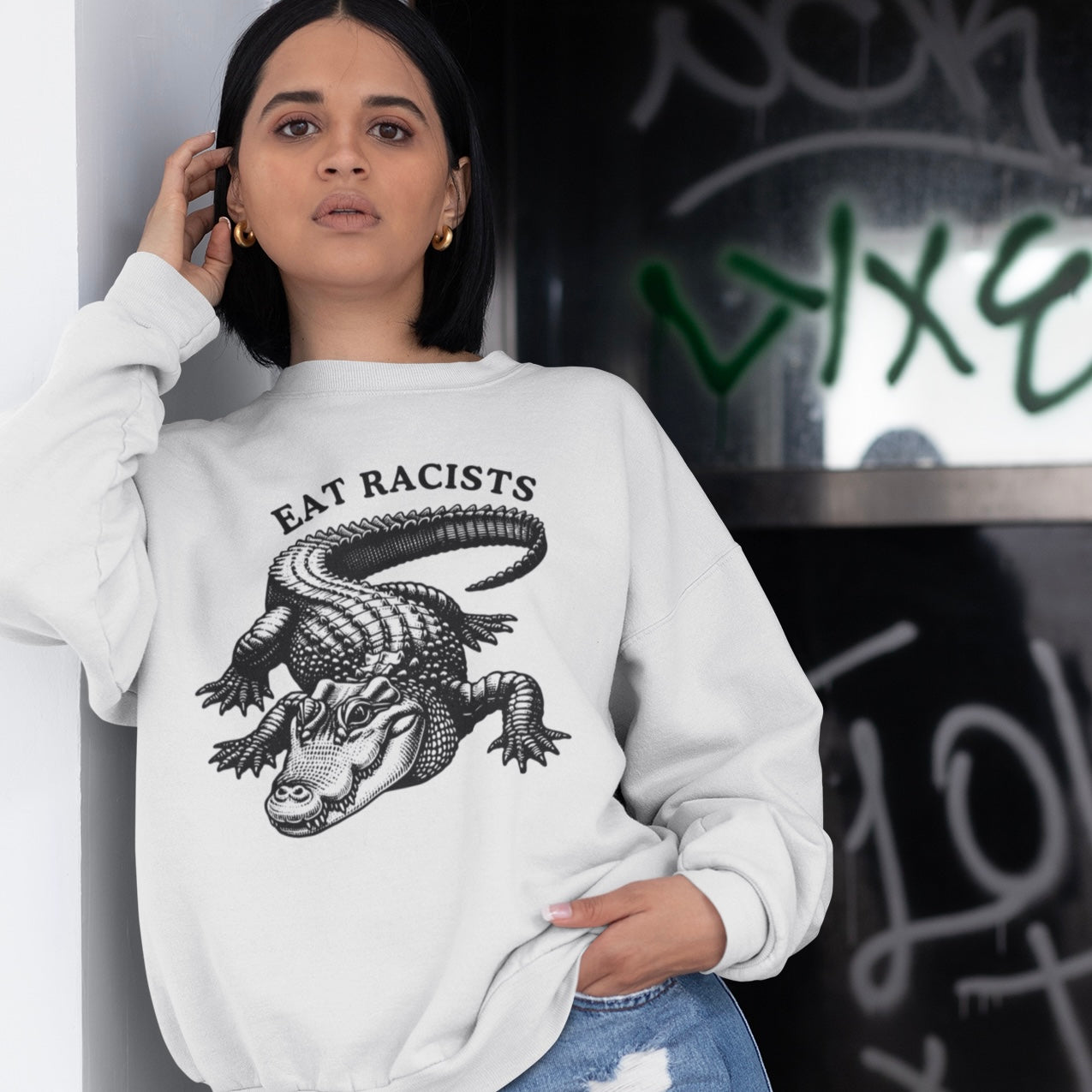 white eat racists political sweatshirt featuring a crocodile illustration- shop feminist trash for political clothing, feminist shirts, pride outfits and acab t-shirts.