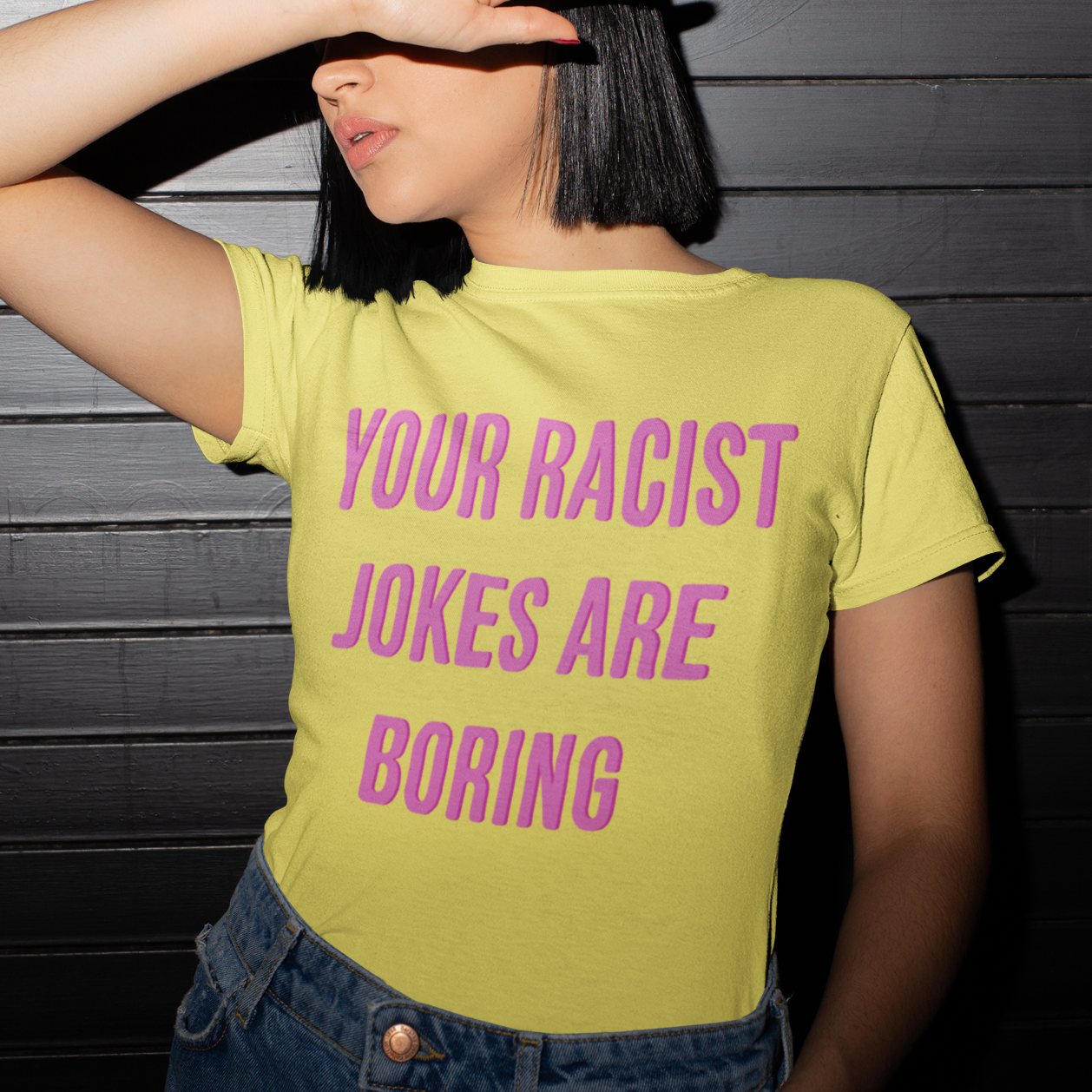 Yellow Feminist T-Shirt that says "Your Racist Jokes Are Boring" in pink writing - Express grl pwr with our feminist clothing, political clothes, dump him shirts, pride shirts and witchy outfits