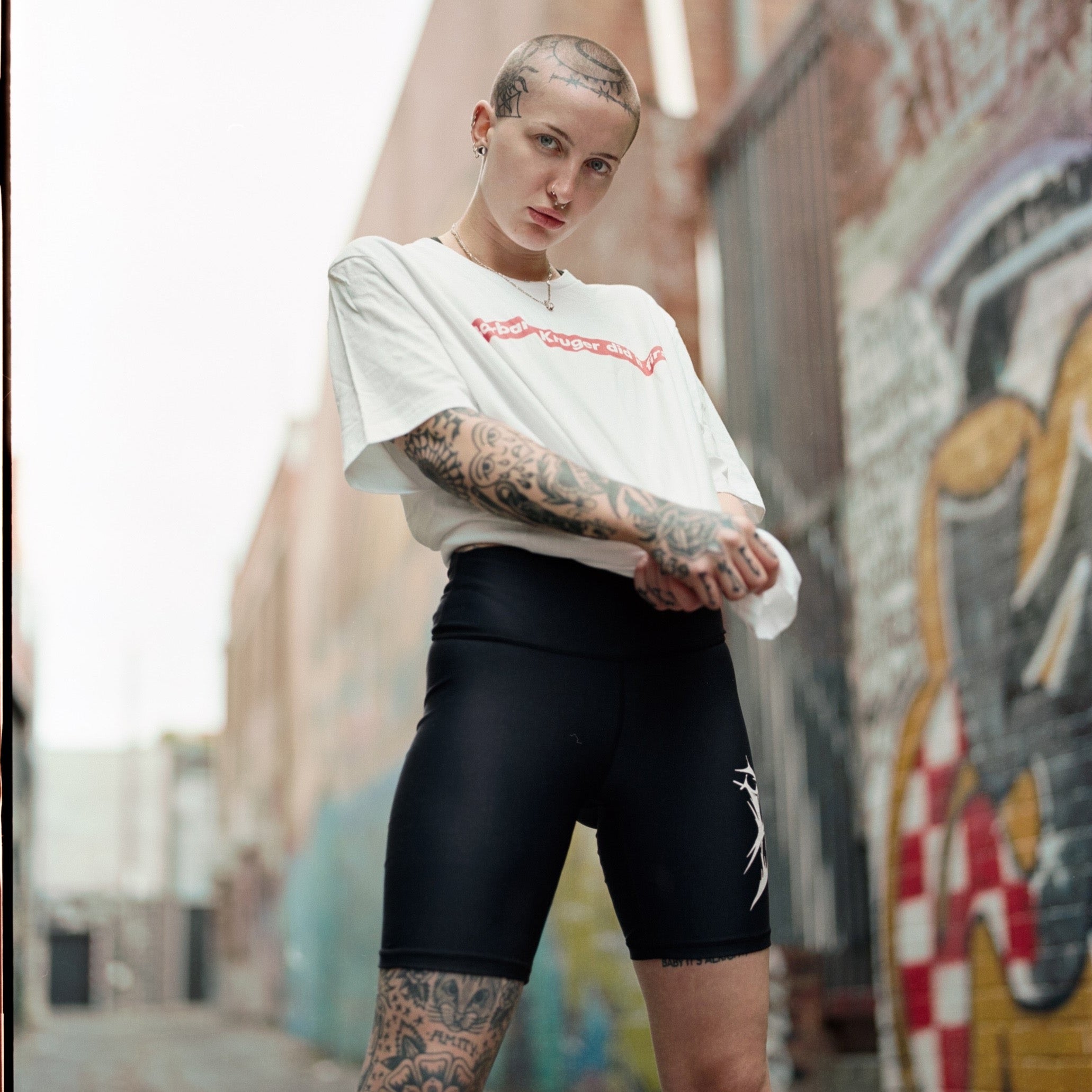 White Feminist T-Shirt that says "Barbara Kruger Did It First" in a Supreme Graphic - Shop Empowering Feminist T Shirts, acab t-shirts, political clothing, dump him shirts and pride outfits.