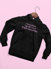 Black feminist hoodie that says Everywhere I Go All I See Is Fragile Masculinity in purple lowercase font Shop Feminist apparel and dump him shirts