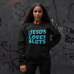 Black feminist sweatshirt that says Jesus Loves Sluts in blue bold hand lettered writing featuring heart illustrations. Shop Feminist Trash Store for feminist t shirts and political clothing.