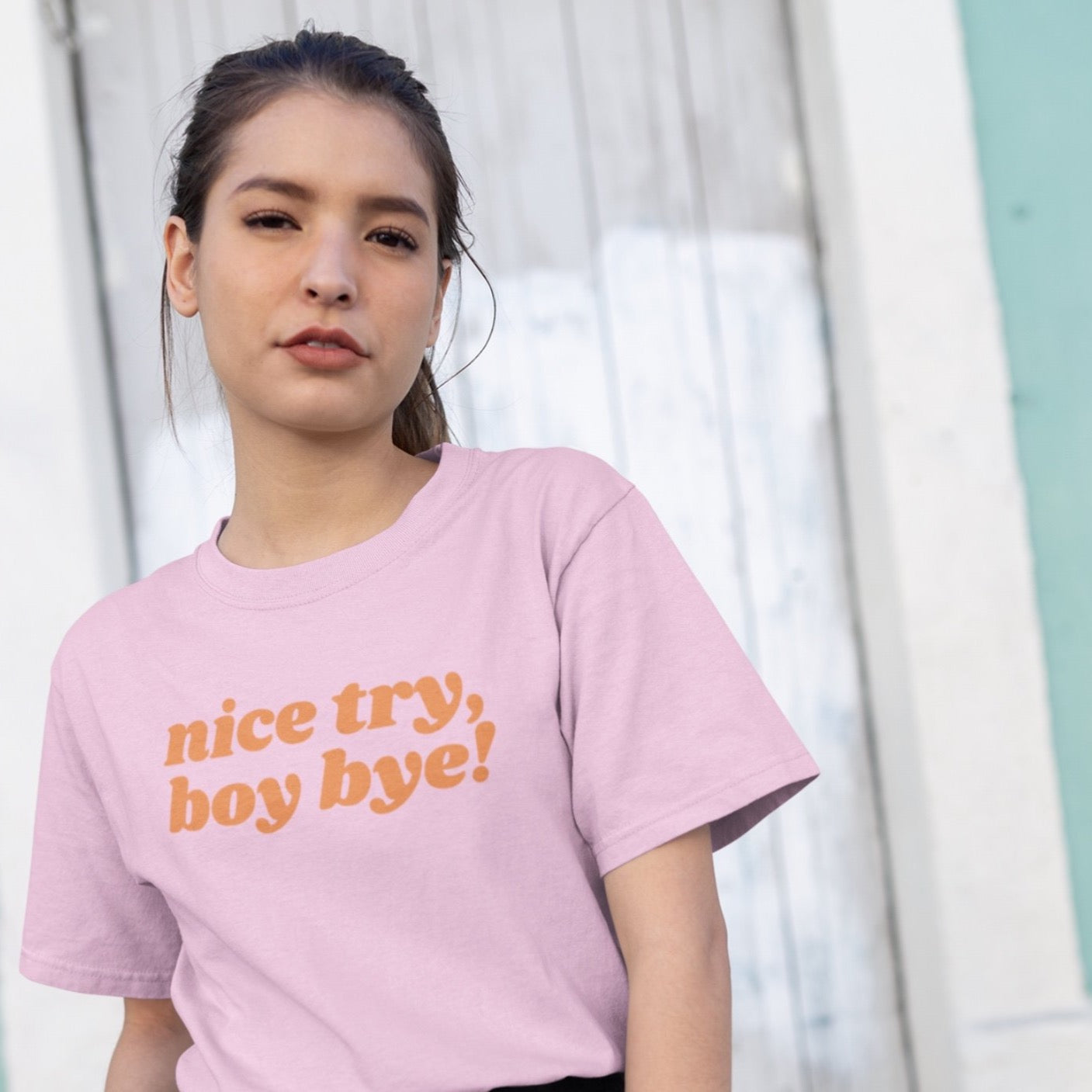 Pink Feminist Tshirt that says Nice Try Boy Bye! in orange lover case retro writing- Shop feminist trash store for feminist shirts, political clothing acab t-shirts, dump him shirts, and pride outfits.